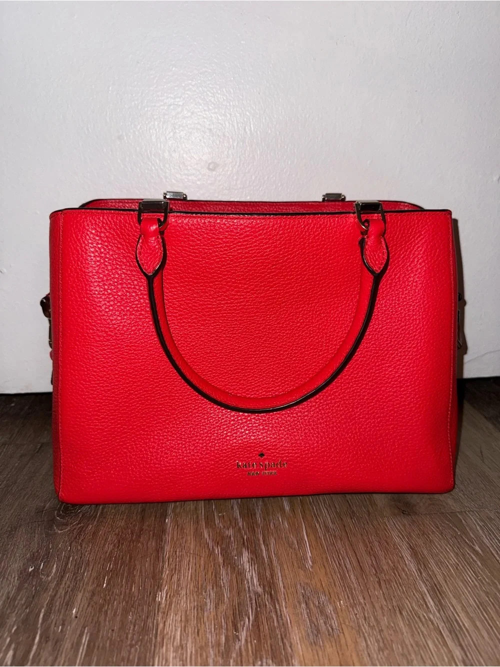 kate spade red pebbled leather satchel with polished hardware